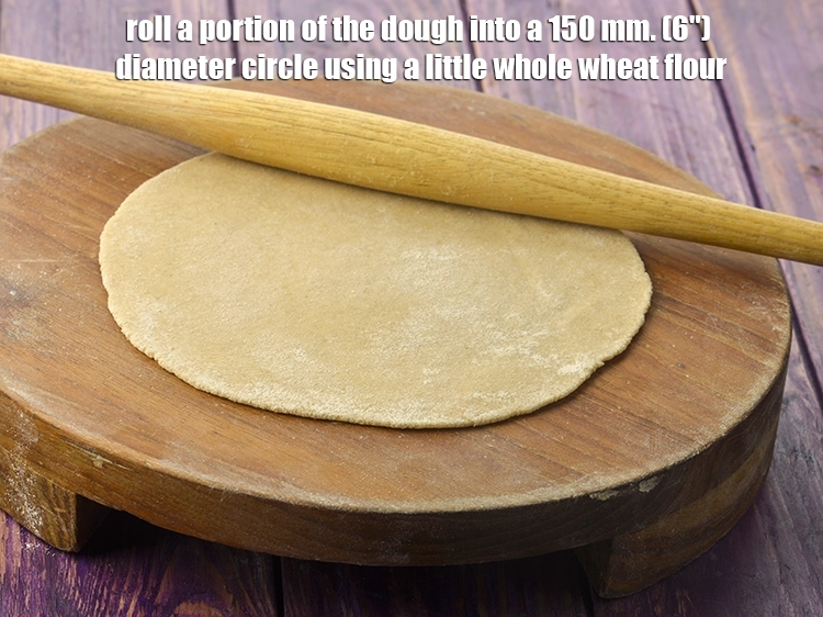 Step 45 – <p>Roll a portion of the <strong>dough</strong> into a 150 mm. (6") diameter circle using a …