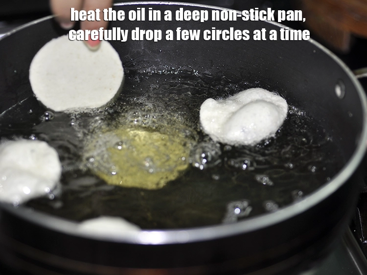 Step 12 – <p>Heat the <a href="https://www.tarladalal.com/glossary-oil-671i"><u>oil</u></a> in a deep non-stick pan, carefully drop a few circles at …