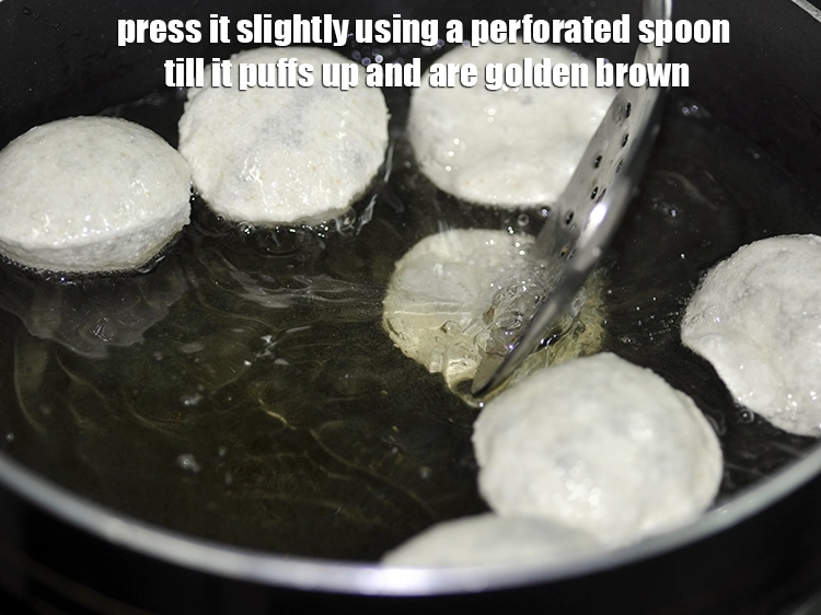 Step 13 – <p>Press it slightly using a perforated spoon till it puffs up and are golden brown.</p>