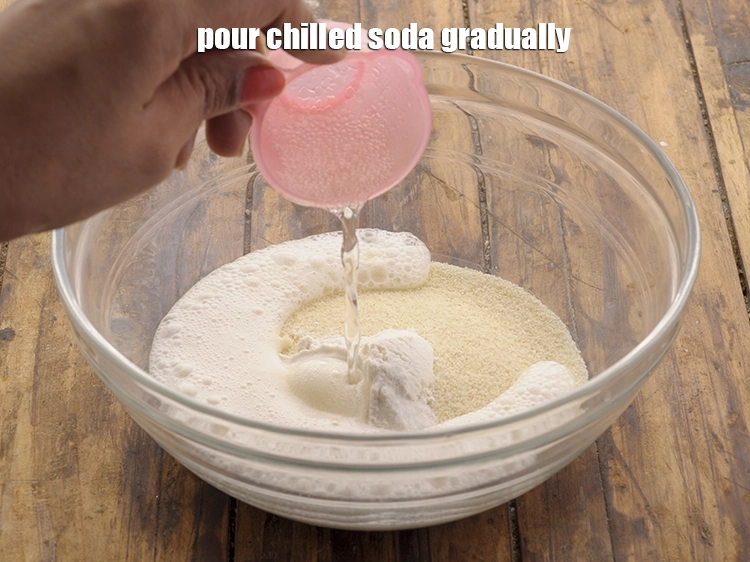 Step 5 – <p>Pour <span style="background-color:rgb(255,255,255);color:rgb(0,0,0);">1/4 cup chilled </span><a href="https://www.tarladalal.com/glossary-soda-club-water-614i"><u>soda</u></a> gradually to make a semi-stiff dough. Instead of …
