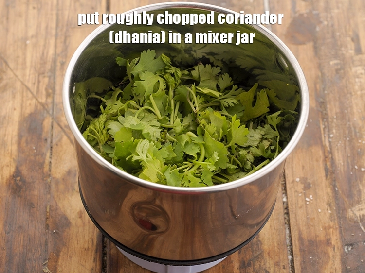 Step 4 – <p><span style="background-color:rgb(255,255,255);color:rgb(0,0,0);">Put the 1 cup roughly </span><a href="https://www.tarladalal.com/glossary-coriander-dhania-kothmir-369i#ing_2365"><u>chopped coriander (dhania)</u></a><span style="background-color:rgb(255,255,255);color:rgb(0,0,0);"> in a mixer jar.</span></p>