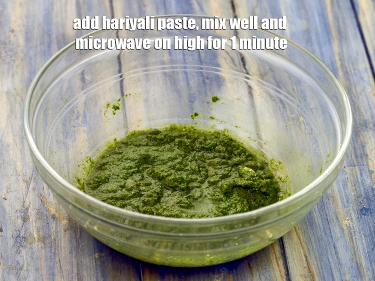 Step 8 – <p><span style="color:rgb(13,13,13);">Add <strong>prepared hariyali paste</strong>, mix well and <strong>microwave on high for 1 minute</strong>.</span></p>