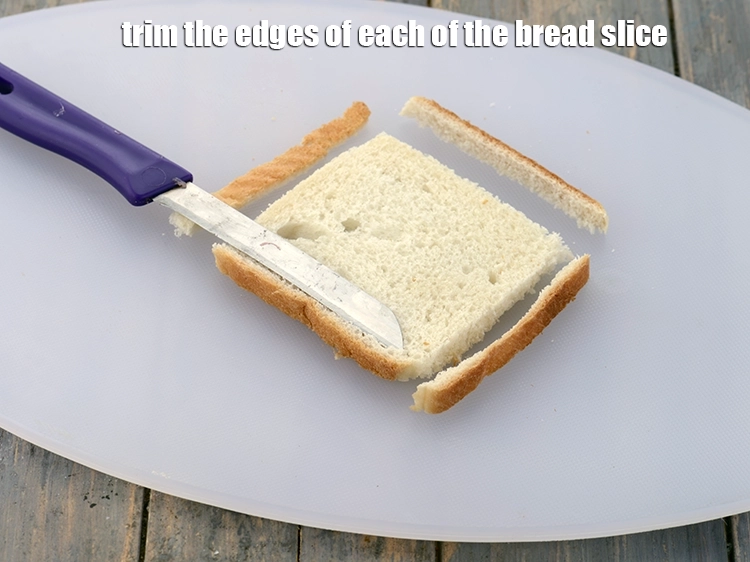 Step 3 – <p><span style="background-color:rgb(255,255,255);color:rgb(0,0,0);">Trim the edges of each of the </span><a href="https://www.tarladalal.com/glossary-bread-219i"><u>bread </u></a><span style="background-color:rgb(255,255,255);color:rgb(0,0,0);">slices.</span></p>