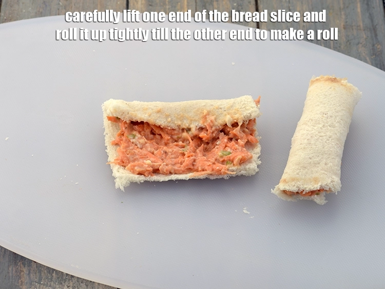 Step 6 – <p><span style="background-color:rgb(255,255,255);color:rgb(0,0,0);">Carefully lift one end of the </span><a href="https://www.tarladalal.com/glossary-bread-219i"><u>bread </u></a><span style="background-color:rgb(255,255,255);color:rgb(0,0,0);">slices and roll it up …