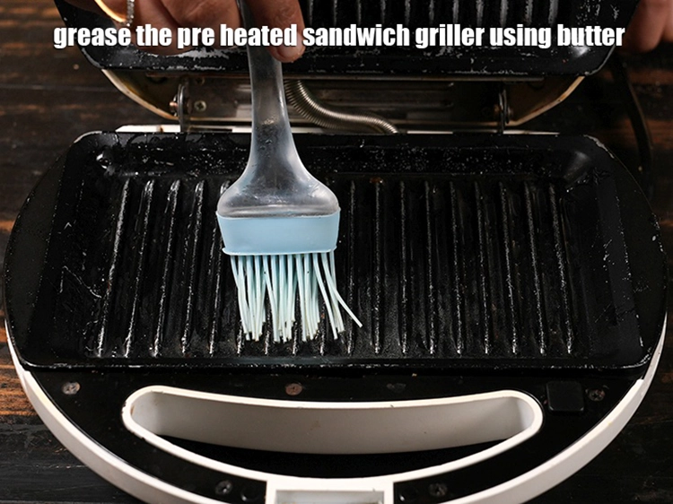 Step 33 – <p>Switch on the <strong>sandwich</strong> griller and grease it lightly with little <a href="https://www.tarladalal.com/glossary-butter-makhan-233i">butter</a>.</p>