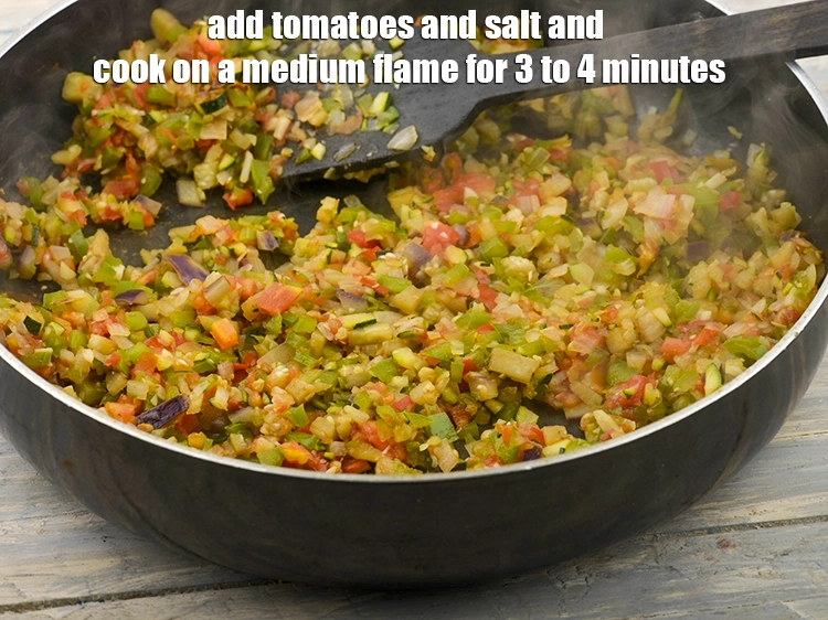 Step 8 – <p><span style="color:rgb(13,13,13);">Add the </span><span style="background-color:rgb(255,255,255);color:rgb(0,0,0);">1/2 cup finely </span><a href="https://www.tarladalal.com/glossary-tomatoes-tamatar-639i#ing_2361"><u>chopped tomato</u></a><span style="color:rgb(13,13,13);"> and </span><a href="https://www.tarladalal.com/glossary-salt-namak-table-salt-418i"><u>salt </u></a><span …
