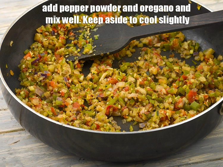 Step 9 – <p><span style="color:rgb(13,13,13);">Add the freshly ground black pepper (kalimirch) and </span><span style="background-color:rgb(255,255,255);color:rgb(0,0,0);">1/2 tsp </span><a href="https://www.tarladalal.com/glossary-dried-oregano-268i"><u>dried oregano</u></a><span …