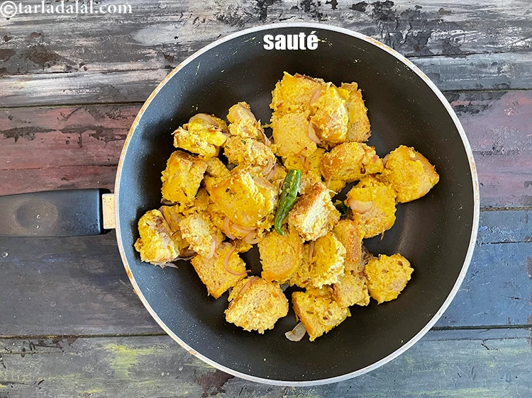 Step 21 – <p>Sauté over low heat, stirring occasionally till the bread browns lightly.</p>