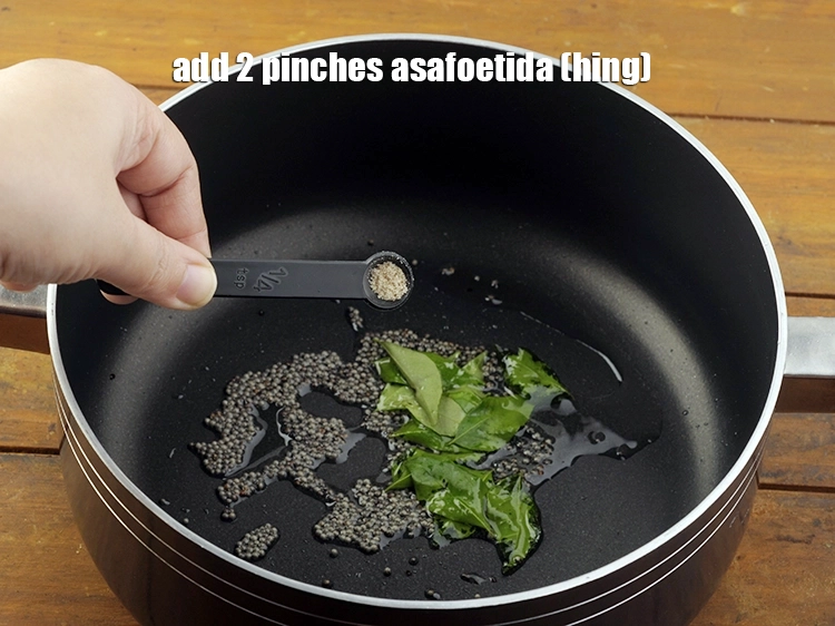 Step 8 – <p>Add 2&nbsp;pinches&nbsp;<a href="https://www.tarladalal.com/glossary-asafoetida-hing-113i">asafoetida (hing)</a>.</p>