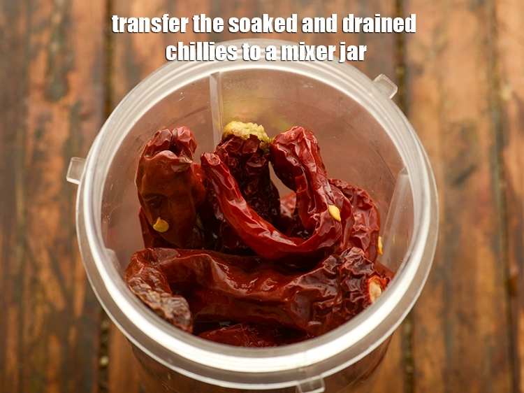 Step 8 – <p>To make <strong>chilli garlic sauce</strong>, transfer the soaked and <strong>drained chillies</strong> to a mixer jar.</p>