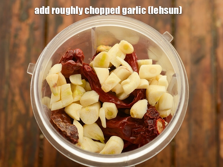 Step 9 – <p>Add <span style="background-color:rgb(255,255,255);color:rgb(0,0,0);">2 tbsp roughly </span><a href="https://www.tarladalal.com/glossary-garlic-lehsun-lahsun-348i#ing_2370"><u>chopped garlic (lehsun)</u></a>. Smash the garlic with the back …