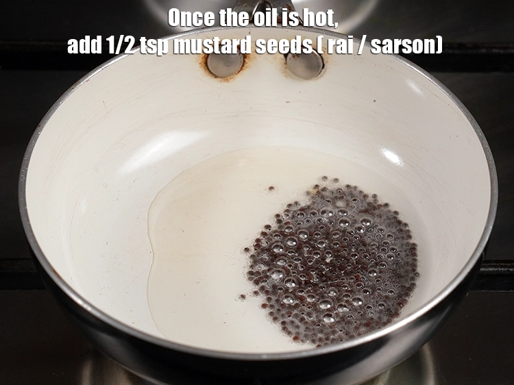 Step 10 – <p>Once the oil is hot, add the <span style="background-color:rgb(255,255,255);color:rgb(0,0,0);">1/2 tsp </span><a href="https://www.tarladalal.com/glossary-mustard-seeds-sarson-rai-sarson-ke-beej-525i"><u>mustard seeds ( rai …
