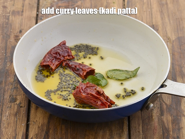 Step 12 – <p>Finally, add <span style="background-color:rgb(255,255,255);color:rgb(0,0,0);">2 to 3 </span><a href="https://www.tarladalal.com/glossary-curry-leaves-kadi-patta-kadipatta-388i"><u>curry leaves (kadi patta)</u></a>. Kadi patta is one …