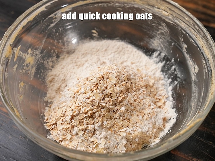 Step 19 – <p><span style="background-color:rgb(255,255,255);color:rgb(0,0,0);">Add 2 tbsp. </span><a href="https://www.tarladalal.com/glossary-quick-cooking-oats-547i"><u>quick cooking oats</u></a><u>.</u></p>