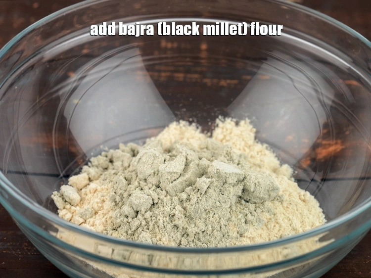Step 3 – <p><span style="background-color:rgb(255,255,255);color:rgb(0,0,0);">To this add 2 tbsp </span><a href="https://www.tarladalal.com/glossary-bajra-flour-bajra-ka-atta-bajre-ka-atta-176i"><u>bajra (black millet) flour</u></a><span style="background-color:rgb(255,255,255);color:rgb(0,0,0);">. This is a …