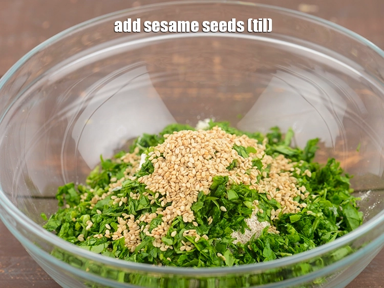 Step 7 – <p><span style="background-color:rgb(255,255,255);color:rgb(0,0,0);">Add 2 tsp </span><a href="https://www.tarladalal.com/glossary-sesame-seeds-til-gingelly-seeds-612i"><u>sesame seeds (til)</u></a><span style="background-color:rgb(255,255,255);color:rgb(0,0,0);">. These add a very nice crunch …