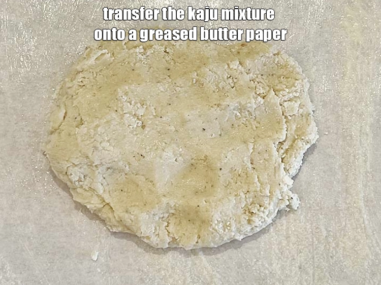 Step 13 – <p><span style="background-color:rgb(255,255,255);color:rgb(0,0,0);">Transfer the <strong>kaju mixture</strong> onto a greased butter paper. We have put the butter …
