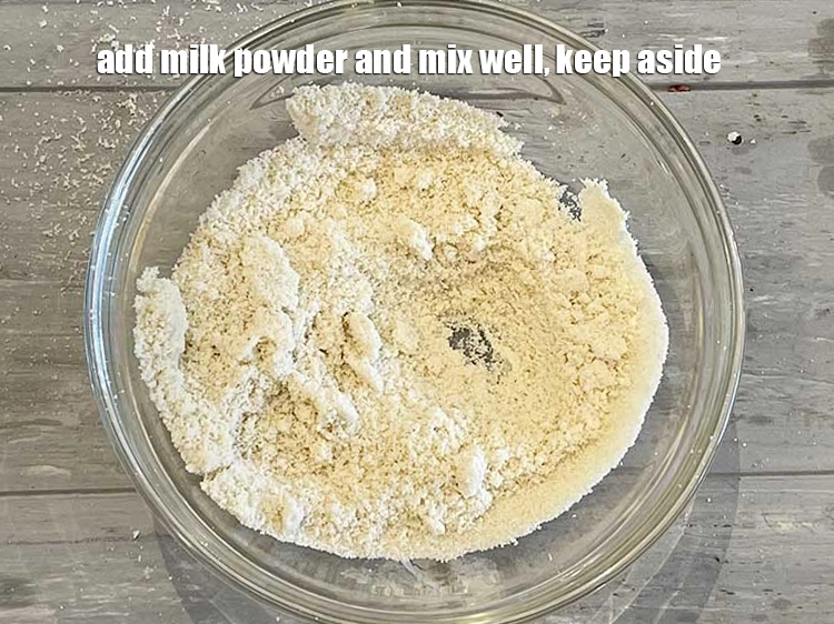 Step 6 – <p>Add <span style="background-color:rgb(255,255,255);color:rgb(0,0,0);">1/4 cup </span><a href="https://www.tarladalal.com/glossary-milk-powder-517i"><u>milk powder,</u></a><u> and </u><span style="background-color:rgb(255,255,255);color:rgb(0,0,0);">mix well and keep aside.</span></p>