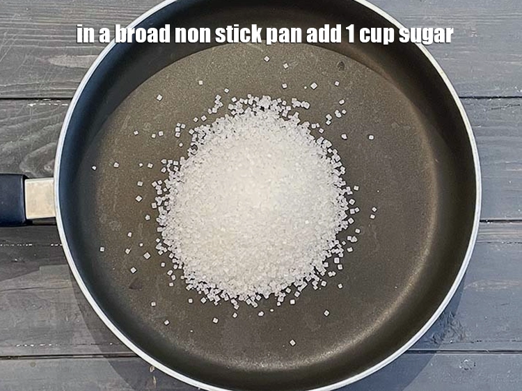 Step 7 – <p>In a broad non stick pan add <span style="background-color:rgb(255,255,255);color:rgb(0,0,0);">1 cup </span><a href="https://www.tarladalal.com/glossary-sugar-chini-shakkar-278i"><u>sugar</u></a> which is about …