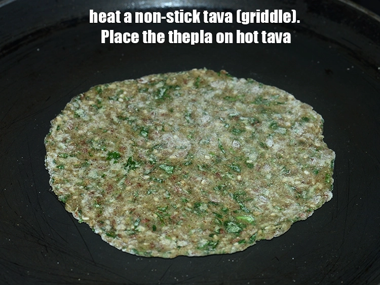 Step 16 – <p><span style="background-color:rgb(255,255,255);color:rgb(0,0,0);">Heat a non-stick tava (griddle).Place the thepla on hot tava.</span></p>