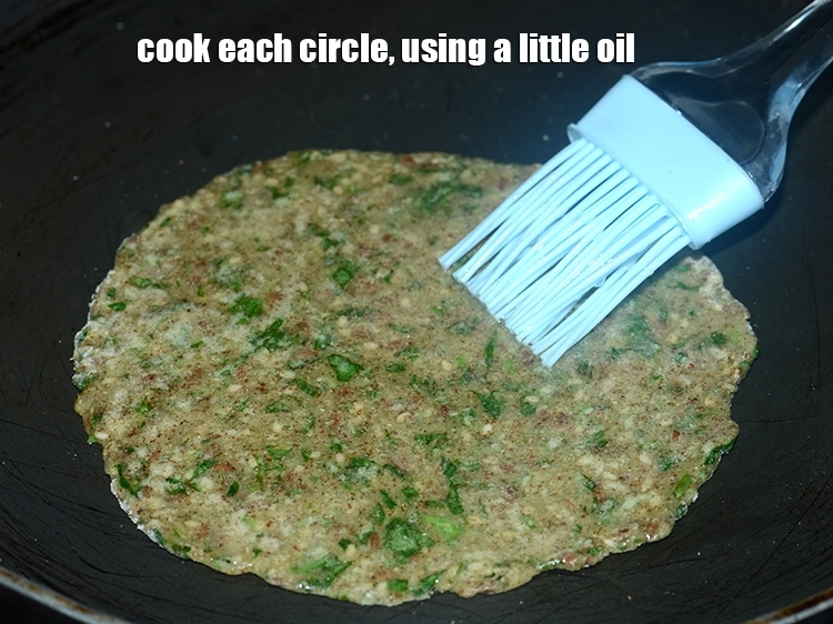 Step 17 – <p><span style="background-color:rgb(255,255,255);color:rgb(0,0,0);">Cook each circle, using a little </span><a href="https://www.tarladalal.com/glossary-oil-671i"><u>oil</u></a><u>.</u></p>