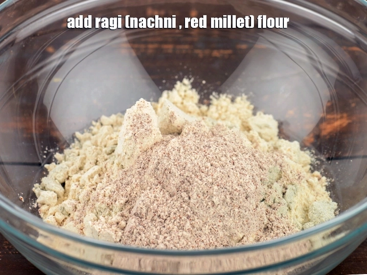 Step 5 – <p>Add <span style="background-color:rgb(255,255,255);color:rgb(0,0,0);">2 tbsp </span><a href="https://www.tarladalal.com/glossary-ragi-flour-nachni-flour-nachni-ka-atta-red-millet-flour-1115i"><u>ragi (nachni , red millet) flour</u></a>. This is rich in …