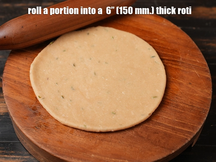Step 27 – <p><span style="background-color:rgb(255,255,255);color:rgb(0,0,0);">Roll a portion into a &nbsp;6” (150 mm.) thick roti. If you find it …