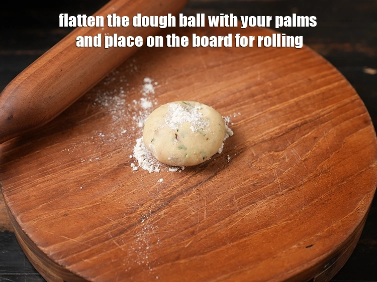 Step 15 – <p>Flatten the dough ball with your palms and place on the board for rolling.</p>