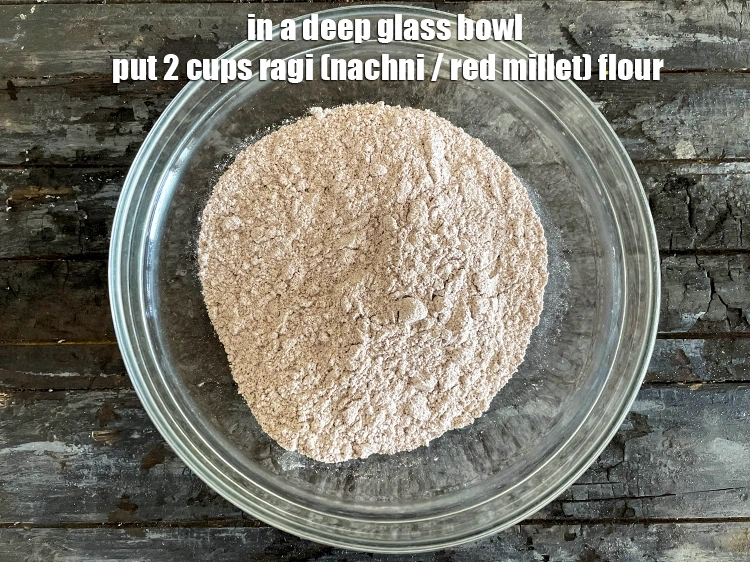 Step 6 – <html><head></head><body><p>In a deep glass bowl put&nbsp;2 cups&nbsp;<a href="glossary-ragi-flour-nachni-flour-nachni-ka-atta-red-millet-flour-1115i">ragi (nachni / red millet) flour</a>.</p></body></html>