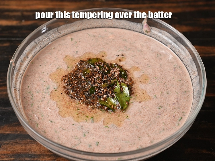 Step 23 – <p>Pour this <strong>tempering</strong> over the batter.&nbsp;</p>