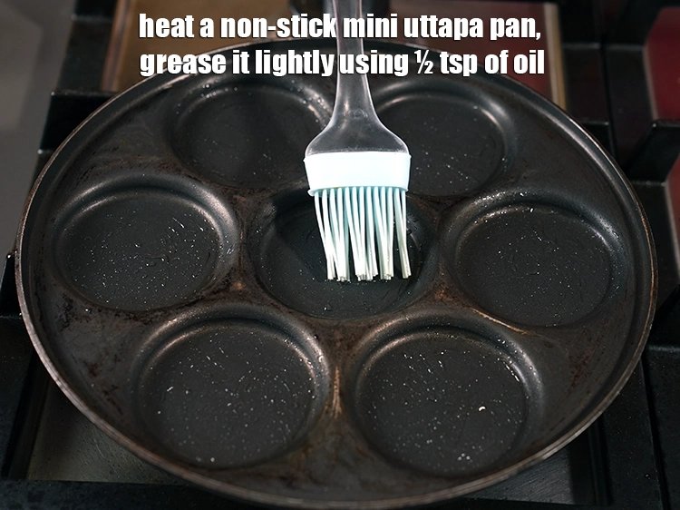 Step 25 – <p>Heat a non-stick <strong>mini uttapa</strong> pan. Grease it lightly using ½ tsp of <a href="https://www.tarladalal.com/glossary-oil-671i"><u>oil …