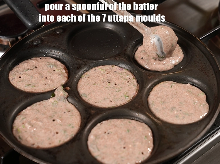 Step 26 – <p>Pour a spoonful of the <strong>batter</strong> into each of the 7 uttapa moulds.</p>