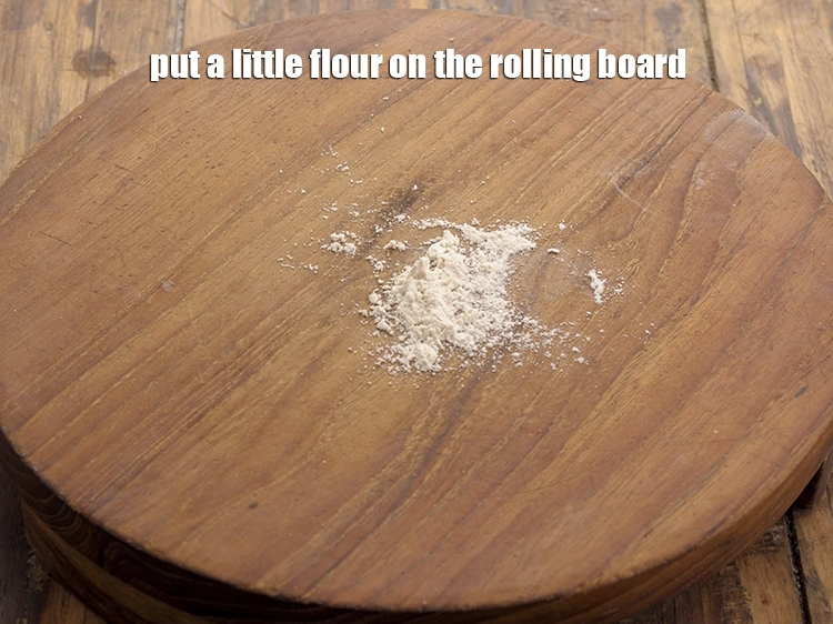 Step 23 – <p><span style="background-color:rgb(255,255,255);color:rgb(0,0,0);">Put a little </span><a href="https://www.tarladalal.com/glossary-whole-wheat-flour-gehun-ka-atta-gehun-ka-aata-429i"><u>whole wheat flour (gehun ka atta)</u></a><span style="background-color:rgb(255,255,255);color:rgb(0,0,0);"> on the rolling …