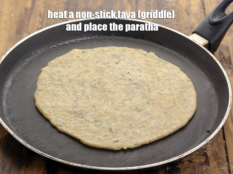 Step 30 – <p>Heat a non-stick tava (griddle) and place the <strong>gobi paratha.</strong></p>