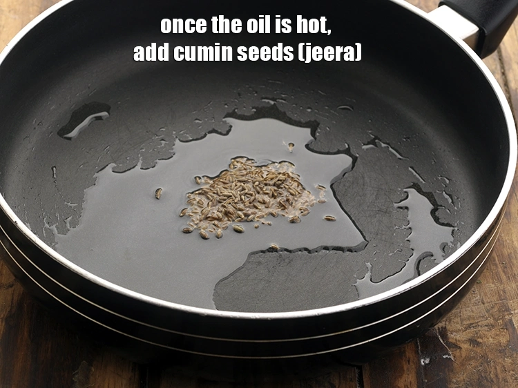 Step 12 – <p>Once the oil is hot, add the <span style="background-color:rgb(255,255,255);color:rgb(0,0,0);">1/2 tsp </span><a href="https://www.tarladalal.com/glossary-cumin-seeds-jeera-zeera-381i"><u>cumin seeds (jeera)</u></a>.</p>