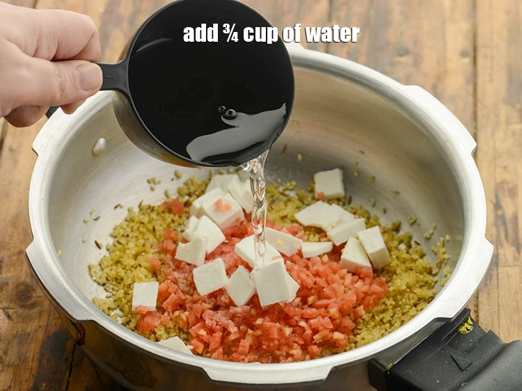 Step 17 – <p>Add ¾ cup of <strong>water</strong> for <strong>vegetable dalia pulao for toddlers</strong>.</p>
