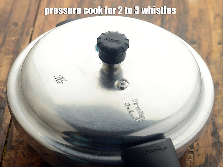 Step 19 – <p>Close the lid of the pressure cooker and cook <strong>bulgur wheat paneer pulao for kids</strong>, …
