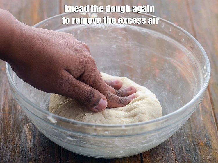 Step 17 – <p>Deflate the dough for <strong>butter naan without tandoor</strong> and knead the dough again to remove …