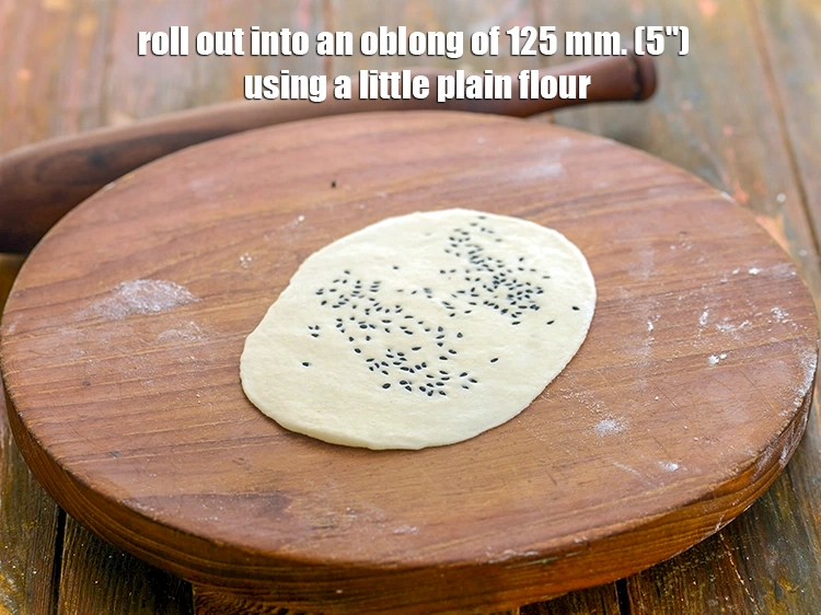 Step 21 – <p>Roll out into an oblong of 125 mm. (5") using a little plain flour.</p>