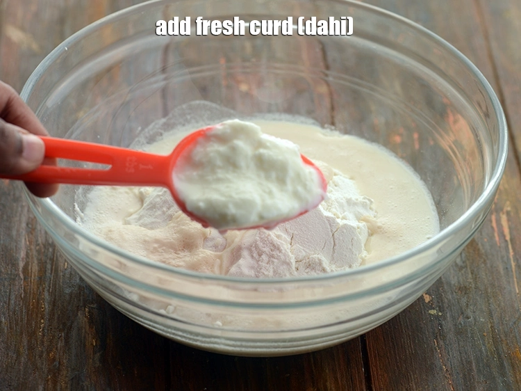 Step 10 – <p>Add <span style="background-color:rgb(255,255,255);color:rgb(0,0,0);">1 tbsp fresh </span><a href="https://www.tarladalal.com/glossary-curd-dahi-yogurt-yoghurt-383i"><u>curd (dahi)</u></a>. Curd acts as a leavening agent and …