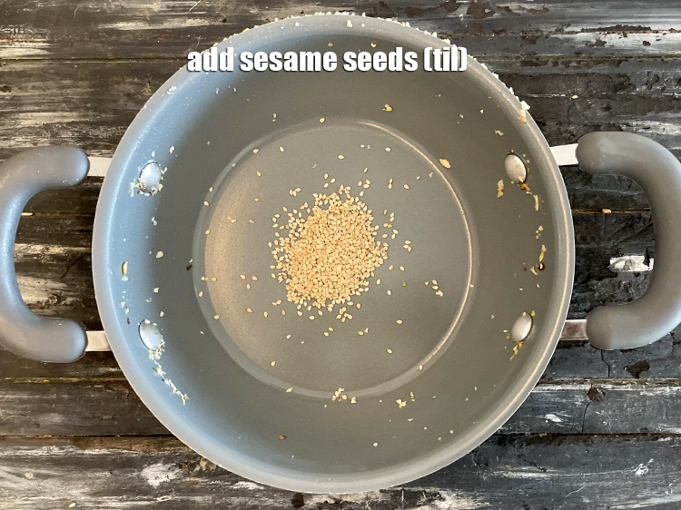 Step 19 – <html><head></head><body><p>Add 1 tbsp&nbsp;<a href="glossary-sesame-seeds-til-gingelly-seeds-612i">sesame seeds (til)</a> in the same pan.</p></body></html>