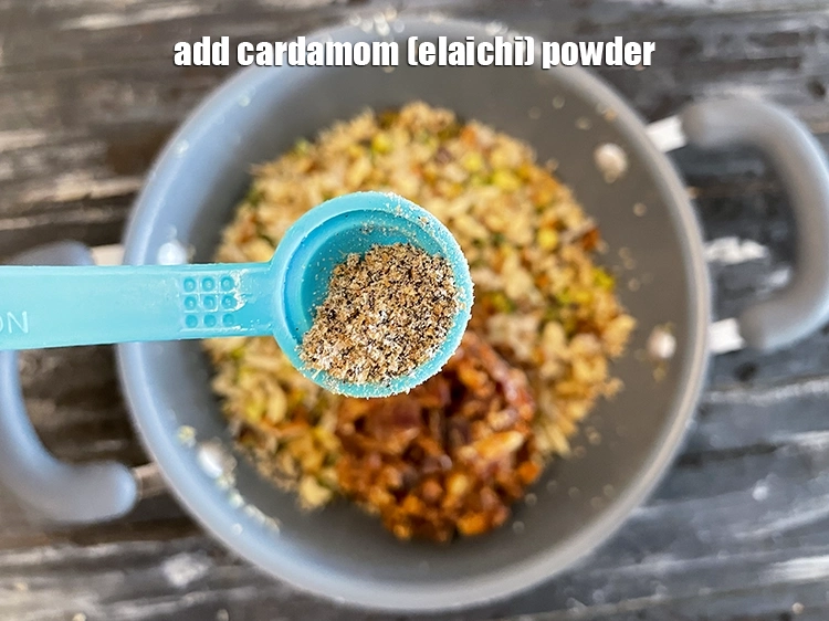 Step 23 – <html><head><meta charset="UTF-8"></head><body><p>Add 1/4 tsp&nbsp;<a href="glossary-cardamom-powder-elaichi-powder-265i">cardamom (elaichi) powder</a>.</p></body></html>