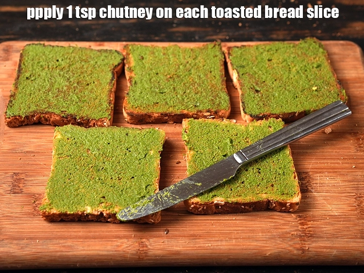 Step 22 – <html><head><meta charset="UTF-8"> </head><body><p>Apply 1 tsp <a href="https://www.tarladalal.com/glossary-green-chutney-2401i"><u>green chutney</u></a> on each&nbsp;toasted bread slice. This is a …