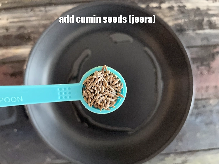Step 4 – <html><head></head><body><p>Add&nbsp;1/2 tsp&nbsp;<a href="glossary-cumin-seeds-jeera-zeera-381i">cumin seeds (jeera)</a>.</p></body></html>