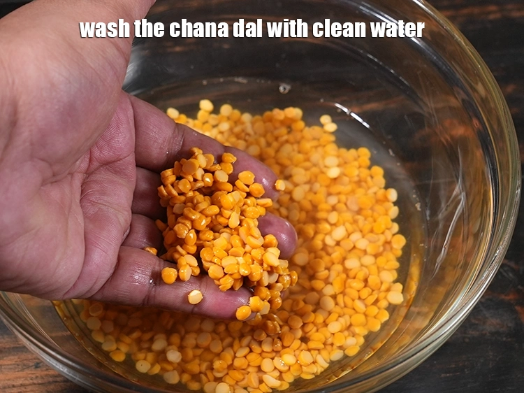 Step 21 – <p>Wash the <strong>chana dal</strong> with clean water.</p>