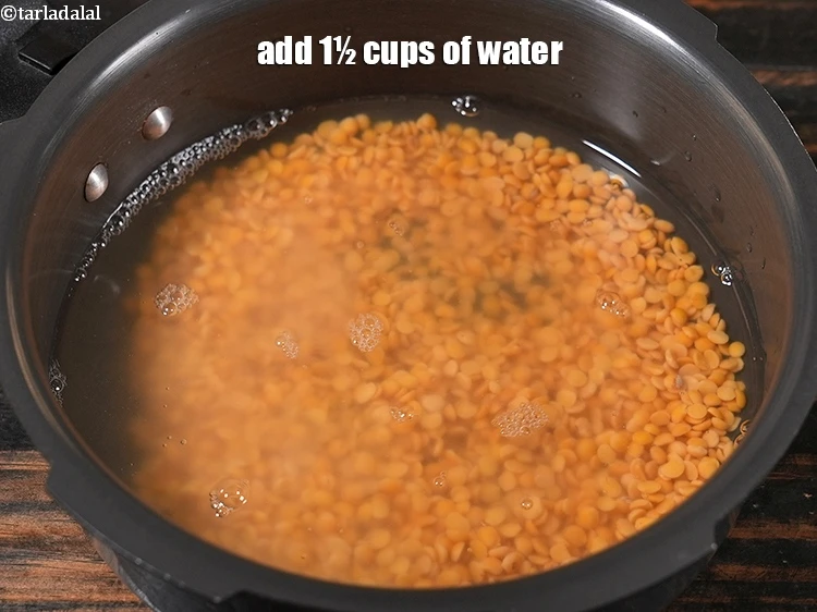 Step 19 – <p>Add 1½ cups of <strong>water</strong> in the pressure cooker, mix well.</p>
