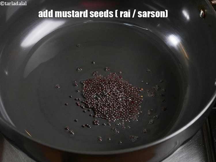 Step 24 – <p>Add the <span style="background-color:rgb(255,255,255);color:rgb(0,0,0);">1 tsp </span><a href="https://www.tarladalal.com/glossary-mustard-seeds-sarson-rai-sarson-ke-beej-525i"><u>mustard seeds ( rai / sarson)</u></a>.</p>