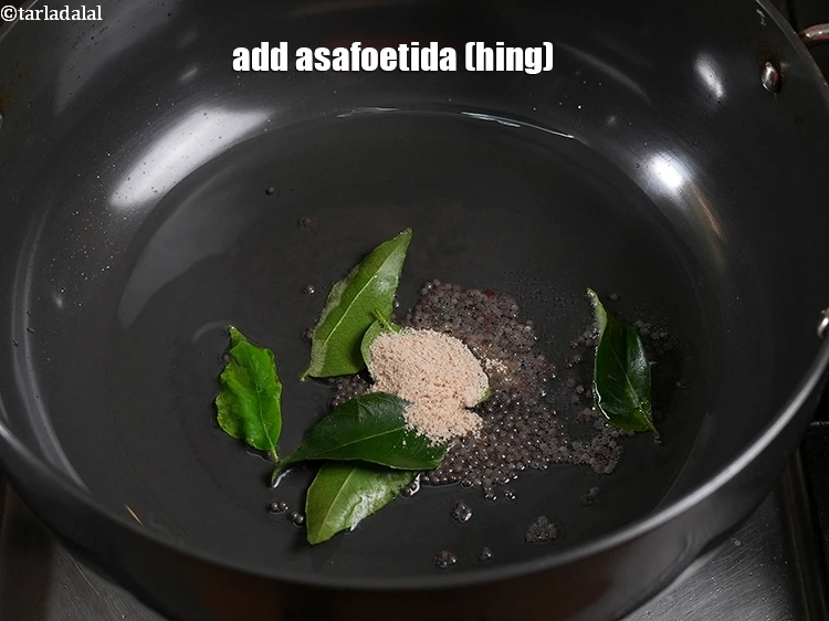 Step 26 – <p>Add&nbsp;1/2 tsp&nbsp;<a href="https://www.tarladalal.com/glossary-asafoetida-hing-113i">asafoetida (hing)</a>.</p>