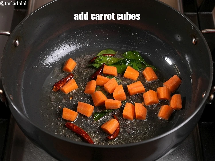 Step 29 – <p>Add the <span style="background-color:rgb(255,255,255);color:rgb(0,0,0);">1/4 cup </span><a href="https://www.tarladalal.com/glossary-carrot-gajar-gajjar-253i#ing_2333"><u>carrot cubes</u></a><u>.</u></p>