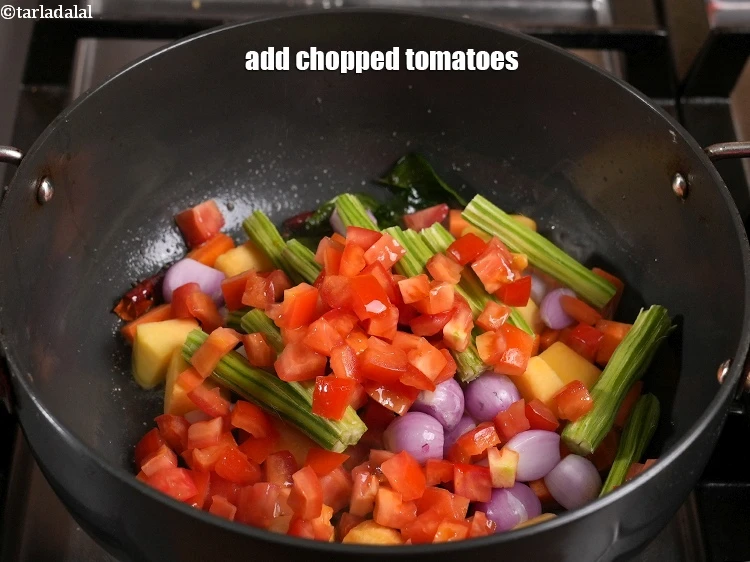 Step 33 – <p>Add 1/2 cup&nbsp;<a href="https://www.tarladalal.com/glossary-chopped-tomatoes-779i">chopped tomatoes</a>.</p>